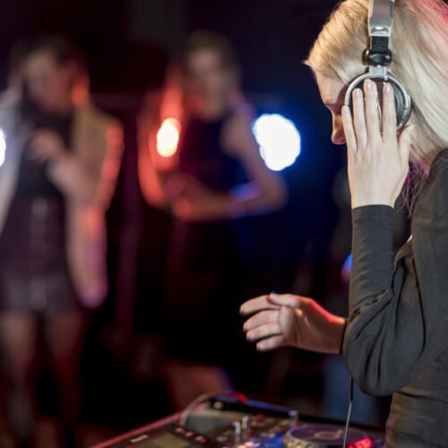 side-view-female-mixing-music